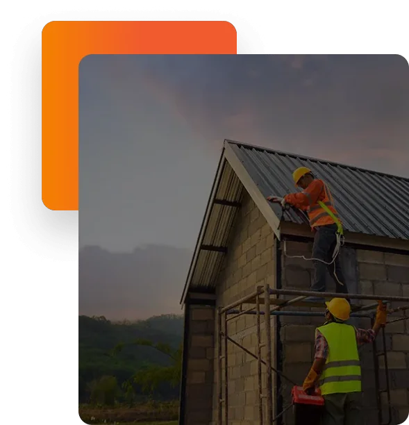 Roofing specialists working on a metal roof